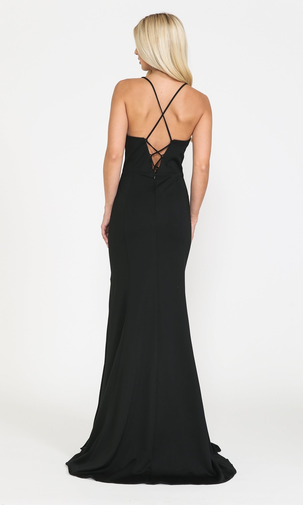 Woman wearing the Open-Back V-Neck Long Simple Jersey Prom Dress 8360, a fitted black gown with crisscross straps and open back, stands facing away from the camera against a plain white background.
